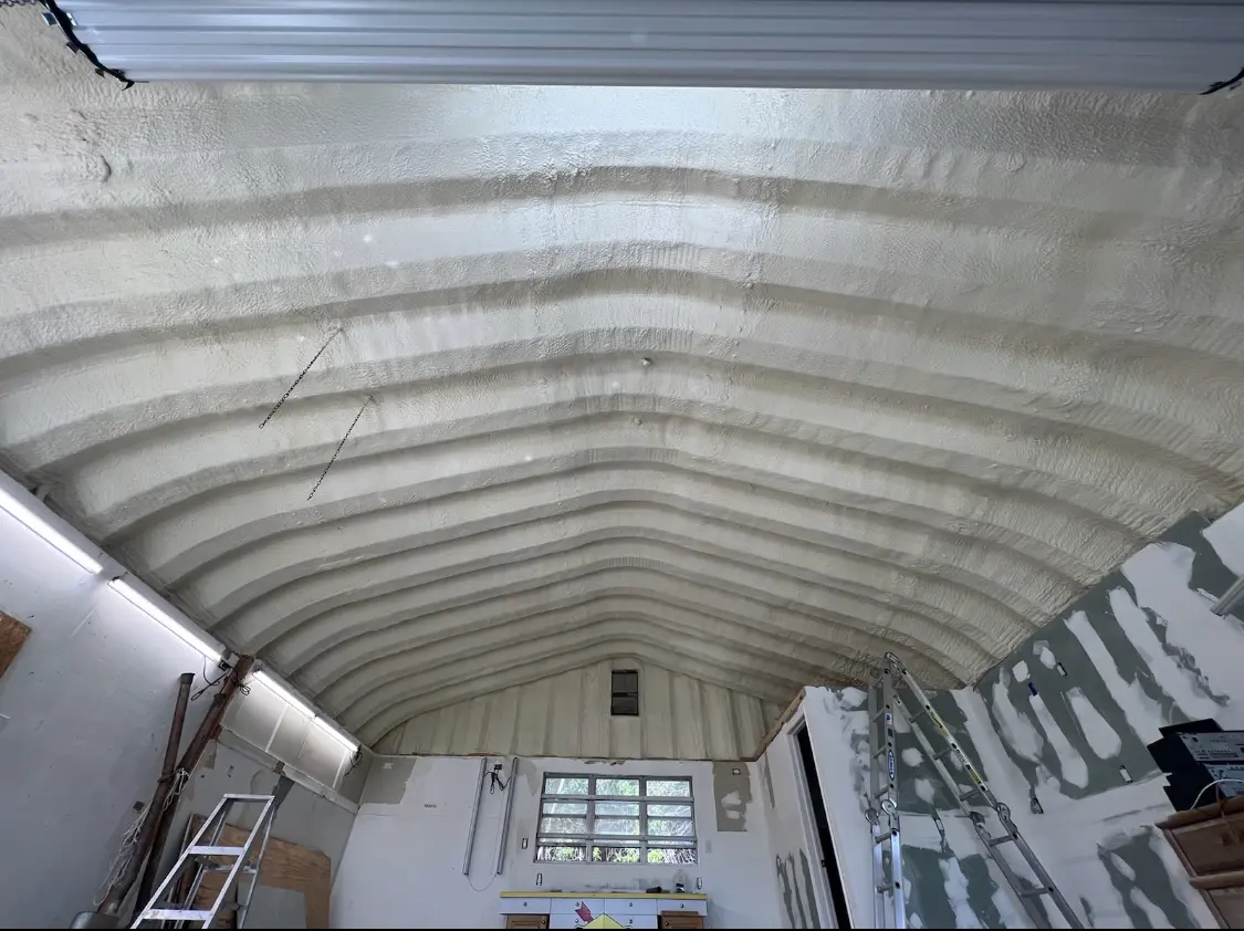 Spray polyurethane foam applied to the underside of a metal roof deck in Walpole